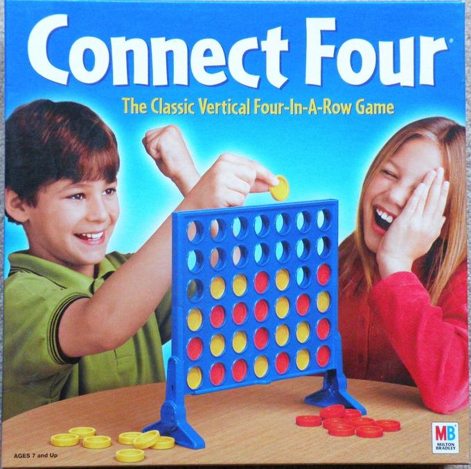 Дети играют в Connect Four Дети играют в Connect Four