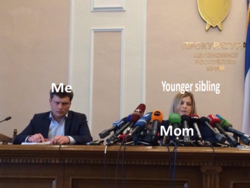 Поклонская с микрофонами и грустный мужик